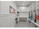Organized mudroom with custom built-in shelving and storage cabinets for shoes and coats at 109 Greenock Ct, Cary, NC 27511