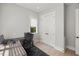 Clean office space featuring a desk, rolling chair, and white double door closet at 109 Greenock Ct, Cary, NC 27511