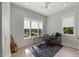 Bright office space with natural light, desk, computer, and a guitar leaning against the wall at 109 Greenock Ct, Cary, NC 27511