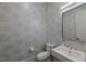 Stylish powder room featuring elegant wallpaper, square sink, and a modern toilet at 109 Greenock Ct, Cary, NC 27511
