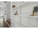 Hallway with custom built-in shelving perfect for displaying decor and books at 1141 Duke Farm Dr, Wake Forest, NC 27587