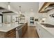 Modern kitchen features an island, custom cabinets, and stainless steel appliances at 1141 Duke Farm Dr, Wake Forest, NC 27587