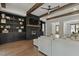 Bright living room with a fireplace, exposed beams, built-ins, and hardwood floors at 1141 Duke Farm Dr, Wake Forest, NC 27587