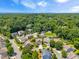 A sprawling neighborhood is nestled among lush greenery and mature trees, offering a serene and private living environment at 118 Fox Run Ct, Durham, NC 27705