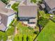 Aerial view of landscaped backyard, cozy screened porch and inviting patio at 118 Fox Run Ct, Durham, NC 27705