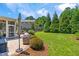 This backyard offers both brick paver patio with grilling area and relaxing screened porch at 118 Fox Run Ct, Durham, NC 27705