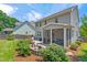 Backyard offers both patio entertaining and cozy screened porch for relaxing outdoors at 118 Fox Run Ct, Durham, NC 27705