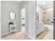 Well-lit bathroom with white vanity, tub, and shower combination at 118 Fox Run Ct, Durham, NC 27705