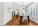 Open dining and kitchen area featuring hardwood floors and natural light at 118 Fox Run Ct, Durham, NC 27705