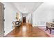 Inviting foyer with hardwood floors, decorative console table, and seamless flow to the dining room at 118 Fox Run Ct, Durham, NC 27705