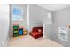 Bright hallway nook with red couch and storage bins at 118 Fox Run Ct, Durham, NC 27705