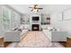 Inviting living room with fireplace, built-in shelves and hardwood floors at 118 Fox Run Ct, Durham, NC 27705