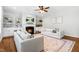 Spacious living room with a fireplace, built-in shelving, and neutral decor at 118 Fox Run Ct, Durham, NC 27705