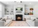Living room with fireplace, built-in shelving, and bright natural light at 118 Fox Run Ct, Durham, NC 27705