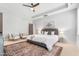 Main bedroom features a ceiling fan, carpet and comfortable sitting area at 118 Fox Run Ct, Durham, NC 27705