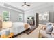 Main bedroom with ceiling fan, en suite bathroom and sitting area at 118 Fox Run Ct, Durham, NC 27705