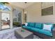 Inviting screened porch boasts comfortable seating and view to backyard entertaining spaces at 118 Fox Run Ct, Durham, NC 27705