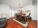Inviting dining room featuring a bay window and elegant wood furniture at 1209 Partington St, Wake Forest, NC 27587