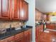 Spacious kitchen with dark countertops and cabinets at 1209 Partington St, Wake Forest, NC 27587