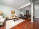 Open-concept living room and dining area with hardwood floors at 1209 Partington St, Wake Forest, NC 27587