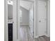 Bright bathroom featuring a black vanity and sink with a large framed round mirror at 1230 Piney Glen Ln, Zebulon, NC 27597