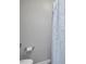 A cozy bathroom scene with a toilet and shower curtain at 1230 Piney Glen Ln, Zebulon, NC 27597
