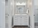 Bathroom featuring a vanity with ample storage, a large mirror, and neutral walls at 1230 Piney Glen Ln, Zebulon, NC 27597