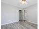 Bedroom with wood-look flooring, ceiling fan, and closet with white doors at 1230 Piney Glen Ln, Zebulon, NC 27597