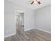Charming dining room boasts modern gray flooring and a ceiling fan for a cozy, updated space at 1230 Piney Glen Ln, Zebulon, NC 27597