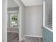 Inviting foyer with an entry door with glass and a view into the bay window off the kitchen at 1230 Piney Glen Ln, Zebulon, NC 27597