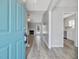 Open foyer with modern gray walls and hardwood floors, leading to living spaces at 1230 Piney Glen Ln, Zebulon, NC 27597