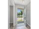 Bright and inviting foyer with hardwood floors and a view of the outdoors at 1230 Piney Glen Ln, Zebulon, NC 27597