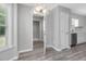 Bright kitchen area with stainless appliances, white subway tile backsplash, and grey wood floors at 1230 Piney Glen Ln, Zebulon, NC 27597