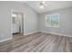 Bright main bedroom with vaulted ceilings, updated wood flooring, and ample natural light at 1230 Piney Glen Ln, Zebulon, NC 27597