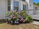 Charming home exterior with a lush hydrangea bush in the front yard at 1230 Piney Glen Ln, Zebulon, NC 27597