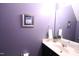 Well-appointed half bathroom featuring modern fixtures, a framed art print, and a clean, contemporary design at 126 Willow Weald Ct, Fuquay Varina, NC 27526