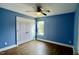 This bedroom has a ceiling fan, window and closet with double doors at 126 Willow Weald Ct, Fuquay Varina, NC 27526