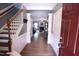 Inviting foyer with wood floors, staircase, and open view into the spacious living area at 126 Willow Weald Ct, Fuquay Varina, NC 27526