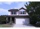 Charming two-story home with stone accents, attached two car garage, and well-manicured lawn at 126 Willow Weald Ct, Fuquay Varina, NC 27526