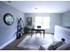 This is a well-lit home office space with a view to the backyard at 126 Willow Weald Ct, Fuquay Varina, NC 27526