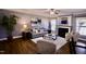 Comfortable living room with fireplace, modern decor, neutral grey walls, and hardwood floors at 126 Willow Weald Ct, Fuquay Varina, NC 27526