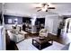 Comfortable living room provides ample seating, natural light, and easy access to the adjacent dining and kitchen spaces at 126 Willow Weald Ct, Fuquay Varina, NC 27526