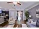 Open-concept living area with hardwood floors connecting kitchen, dining, and living spaces at 126 Willow Weald Ct, Fuquay Varina, NC 27526