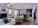 Open-concept living area with a fireplace, bar seating, and dining space at 126 Willow Weald Ct, Fuquay Varina, NC 27526
