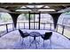 Covered patio with furniture and beautiful outdoor views provides ideal relaxation space at 126 Willow Weald Ct, Fuquay Varina, NC 27526