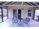 Relax on this covered patio featuring an elegant rug and furniture set at 126 Willow Weald Ct, Fuquay Varina, NC 27526