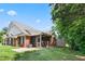 A beautiful brick home with a screened-in porch and well-maintained lawn, perfect for outdoor living at 127 Bobwhite Way, Mebane, NC 27302