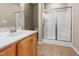 Bathroom featuring a single vanity with a shower and glass doors at 127 Bobwhite Way, Mebane, NC 27302