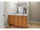 Bathroom showcasing a large vanity with double sinks and neutral tile flooring at 127 Bobwhite Way, Mebane, NC 27302