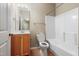 Well-lit bathroom features a shower-tub combo, a vanity sink, and neutral finishes at 127 Bobwhite Way, Mebane, NC 27302